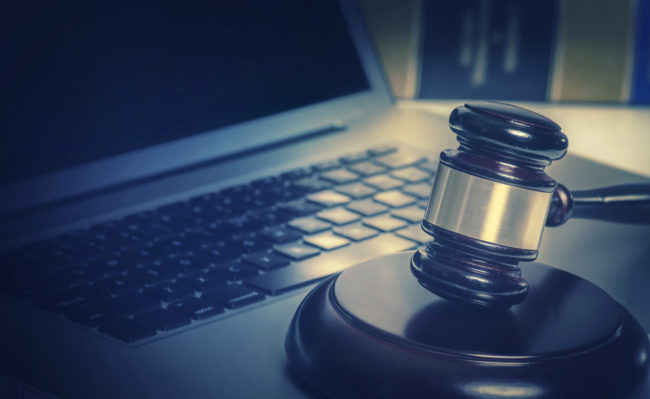 Legal law concept image gavel on computer laptop